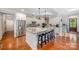 Spacious kitchen with granite counters, stainless steel appliances, and a large island at 1010 Nutall Oak Ln, Belmont, NC 28012