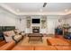 Inviting living room with a cozy fireplace and elegant decor, perfect for relaxation at 1010 Nutall Oak Ln, Belmont, NC 28012