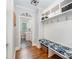 Well-organized mudroom featuring built-in shelving, hooks, and a bench with storage at 1010 Nutall Oak Ln, Belmont, NC 28012