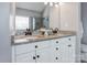 Elegant bathroom featuring double sinks with granite countertops and modern fixtures at 104 Steamboat Dr, Mount Holly, NC 28120