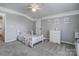 Well-lit bedroom featuring a playful bedspread, neutral walls, and bright natural light at 104 Steamboat Dr, Mount Holly, NC 28120