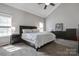 Spacious main bedroom featuring vaulted ceilings and a comfortable king-sized bed at 104 Steamboat Dr, Mount Holly, NC 28120