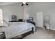 Bright main bedroom featuring vaulted ceilings, ceiling fan, and carpeted floors at 104 Steamboat Dr, Mount Holly, NC 28120