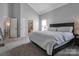 Spacious main bedroom featuring vaulted ceilings and a comfortable king-sized bed at 104 Steamboat Dr, Mount Holly, NC 28120