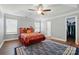 Spacious bedroom with a ceiling fan, hardwood floors, and walk in closet at 10431 Plantain Ct, Charlotte, NC 28213