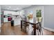 Modern kitchen with stainless appliances, granite countertops, wood flooring and access to the backyard at 10431 Plantain Ct, Charlotte, NC 28213