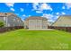 Spacious backyard with a well-maintained lawn and wooden deck, perfect for outdoor enjoyment at 10906 Charmont Pl, Huntersville, NC 28078