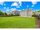 Spacious backyard with manicured lawn and wooden fence at 10906 Charmont Pl, Huntersville, NC 28078