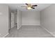 Bright bedroom with plush carpet, ceiling fan, and ensuite bathroom at 10906 Charmont Pl, Huntersville, NC 28078