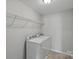 Laundry room with washer, dryer, and wire shelving at 10906 Charmont Pl, Huntersville, NC 28078
