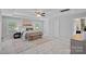 Spacious main bedroom with tray ceiling, plush carpet, and a large window at 10906 Charmont Pl, Huntersville, NC 28078