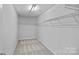 Empty walk-in closet with white walls, carpeted floor, and wire shelving at 10906 Charmont Pl, Huntersville, NC 28078
