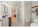 Bright bathroom features a glass door shower and a view to the Gathering room in neutral paint colors and tile flooring at 11102 Sundown Ln, Charlotte, NC 28226