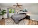 Relaxing bedroom with a large bed, soft rug, and a window offering natural light and scenic views at 11102 Sundown Ln, Charlotte, NC 28226