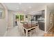 Inviting dining area with seating for six, sliding door access to a patio, and adjacent kitchen at 11102 Sundown Ln, Charlotte, NC 28226