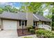 A cozy single-story house boasts a well-maintained lawn, neutral siding, and a convenient attached garage at 11102 Sundown Ln, Charlotte, NC 28226