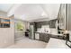 Modern kitchen features stainless steel appliances, gray cabinets, and bright white countertops at 11102 Sundown Ln, Charlotte, NC 28226