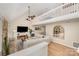 Bright open-concept living room featuring vaulted ceilings, stone fireplace, loft, and modern decor at 11102 Sundown Ln, Charlotte, NC 28226