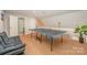 Large recreation room featuring hardwood floors and a ping pong table at 11102 Sundown Ln, Charlotte, NC 28226