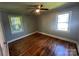 Inviting bedroom with hardwood floors and natural light from two windows at 1119 Sanders St, Rock Hill, SC 29732