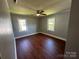 Comfortable bedroom with ceiling fan and two windows offering natural light at 1119 Sanders St, Rock Hill, SC 29732