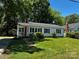 Charming single-story home with a well-maintained lawn and inviting front porch at 1119 Sanders St, Rock Hill, SC 29732