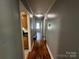 Hallway with wooden floor leading into other rooms at 1119 Sanders St, Rock Hill, SC 29732