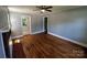 Spacious living room with a fireplace and gleaming hardwood floors at 1119 Sanders St, Rock Hill, SC 29732