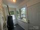 Cozy sunroom with bright windows, wood-paneled ceiling, and fresh paint is a welcoming space at 1119 Sanders St, Rock Hill, SC 29732