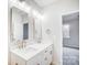 This bathroom features double sinks with modern fixtures and lighting, with access to the bedroom at 112 Bickett Ave, Gastonia, NC 28052