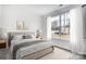 This bedroom has a neutral color palette and large windows for plenty of natural light at 112 Bickett Ave, Gastonia, NC 28052