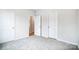 This bedroom features neutral paint, carpeting, and a double door closet at 112 Bickett Ave, Gastonia, NC 28052