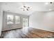 Bright open living space with modern hardwood floors, recessed lighting, and a glass sliding door to the yard at 112 Bickett Ave, Gastonia, NC 28052