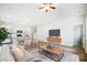 Bright open living room with modern furniture, dining area, and an open kitchen with stainless appliances at 112 Bickett Ave, Gastonia, NC 28052