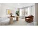 This home office features a large window, a stylish desk, and a comfortable chair at 112 Bickett Ave, Gastonia, NC 28052
