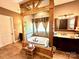 Spacious bathroom showcasing a jacuzzi tub, wooden accents, tile flooring, vanity and a separate room at 1140 Fern Hill Rd, Mooresville, NC 28117