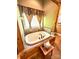 Relaxing bathroom with a jacuzzi tub, surrounded by elegant tile work and decorative wooden accents at 1140 Fern Hill Rd, Mooresville, NC 28117
