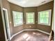 Neutral bedroom with natural light showcases three windows, carpeted floors at 1140 Fern Hill Rd, Mooresville, NC 28117