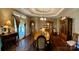 Elegant dining room featuring a fireplace, a grand dining table, and bespoke furnishings for refined entertaining at 1140 Fern Hill Rd, Mooresville, NC 28117