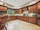 Spacious kitchen boasts custom cabinetry, granite countertops and stainless steel appliances at 1140 Fern Hill Rd, Mooresville, NC 28117