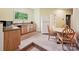 Small kitchenette with wood cabinets, full sized refrigerator, and table with chairs at 1140 Fern Hill Rd, Mooresville, NC 28117