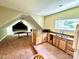 Spacious living room features unique architecture, kitchenette and carpeted flooring at 1140 Fern Hill Rd, Mooresville, NC 28117