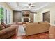Inviting living room with hardwood floors, fireplace, and comfortable seating at 1140 Fern Hill Rd, Mooresville, NC 28117