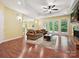 Open living room featuring hardwood floors, coffered ceilings, and large windows at 1140 Fern Hill Rd, Mooresville, NC 28117