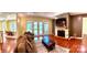 Comfortable living room with hardwood floors, a fireplace, and access to outdoor patio through glass doors at 1140 Fern Hill Rd, Mooresville, NC 28117