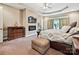 Serene main bedroom features tray ceilings, a cozy fireplace, and neutral decor at 1140 Fern Hill Rd, Mooresville, NC 28117