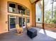 Covered porch with wooden rocking chairs and decorative railing for outdoor relaxation at 1140 Fern Hill Rd, Mooresville, NC 28117