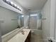 Well-lit bathroom featuring a vanity and shower-tub combination at 11505 Sweetbriar Ridge Dr, Charlotte, NC 28269