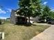 Side view of a two-story home with a front porch and a well-kept lawn at 11505 Sweetbriar Ridge Dr, Charlotte, NC 28269