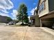 Home exterior showing a driveway and two-car garage with a partial view of the front porch at 11505 Sweetbriar Ridge Dr, Charlotte, NC 28269